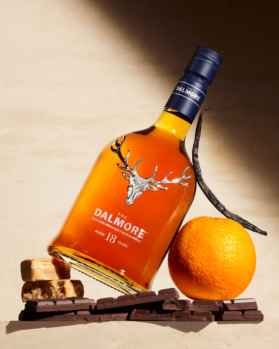 Bottle of Dalmore 18, an orange, chocolate, fudge and a vanilla pod